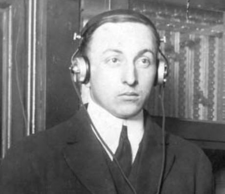 Leo Young wearing radio headphones