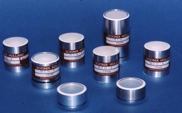 Several crystal-only assemblies in sealed aluminum canisters with optical windows.