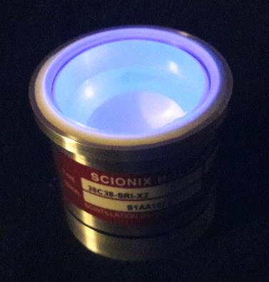 A crystal-only C-style assembly in a sealed canister with the crystal face glowing.