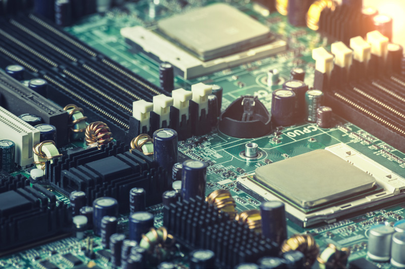 Close view of a populated circuit board with processors and power components